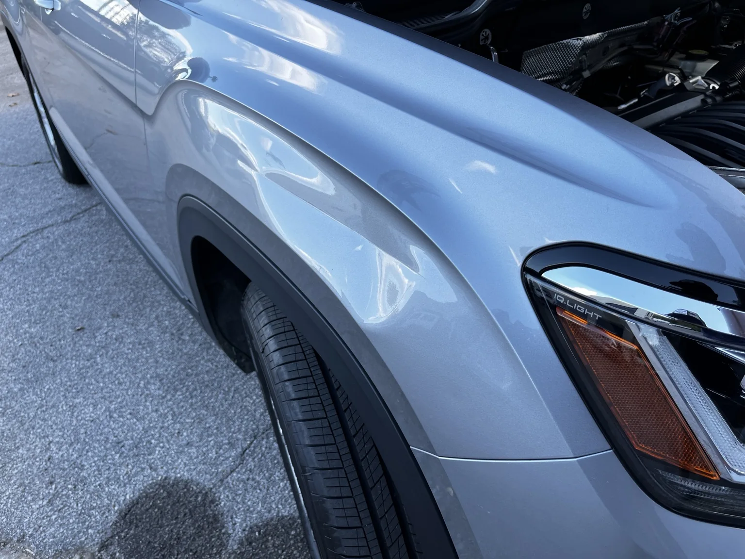 Volkswagen Atlas fender crease before paintless dent repair
