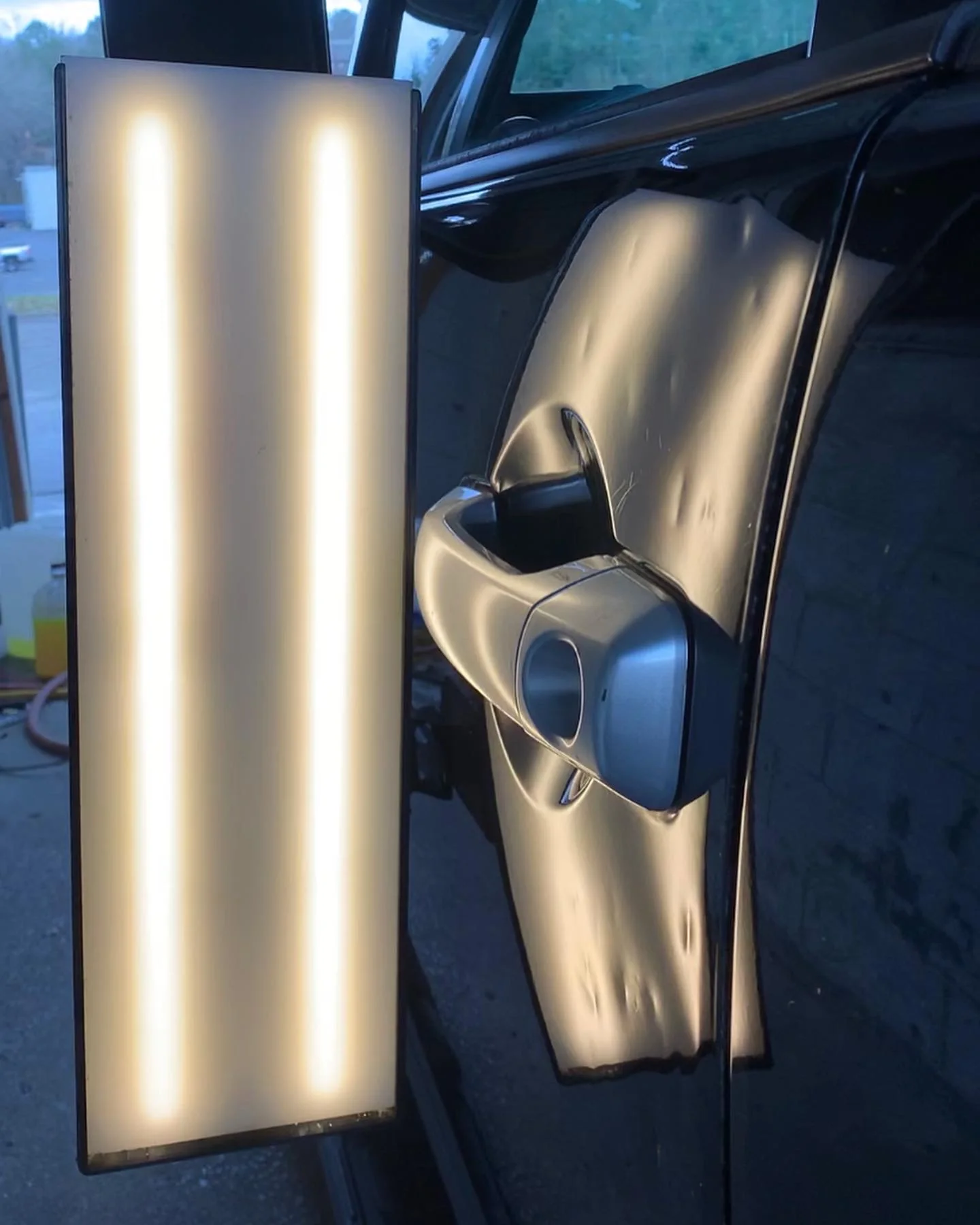 Door ding before paintless dent repair
