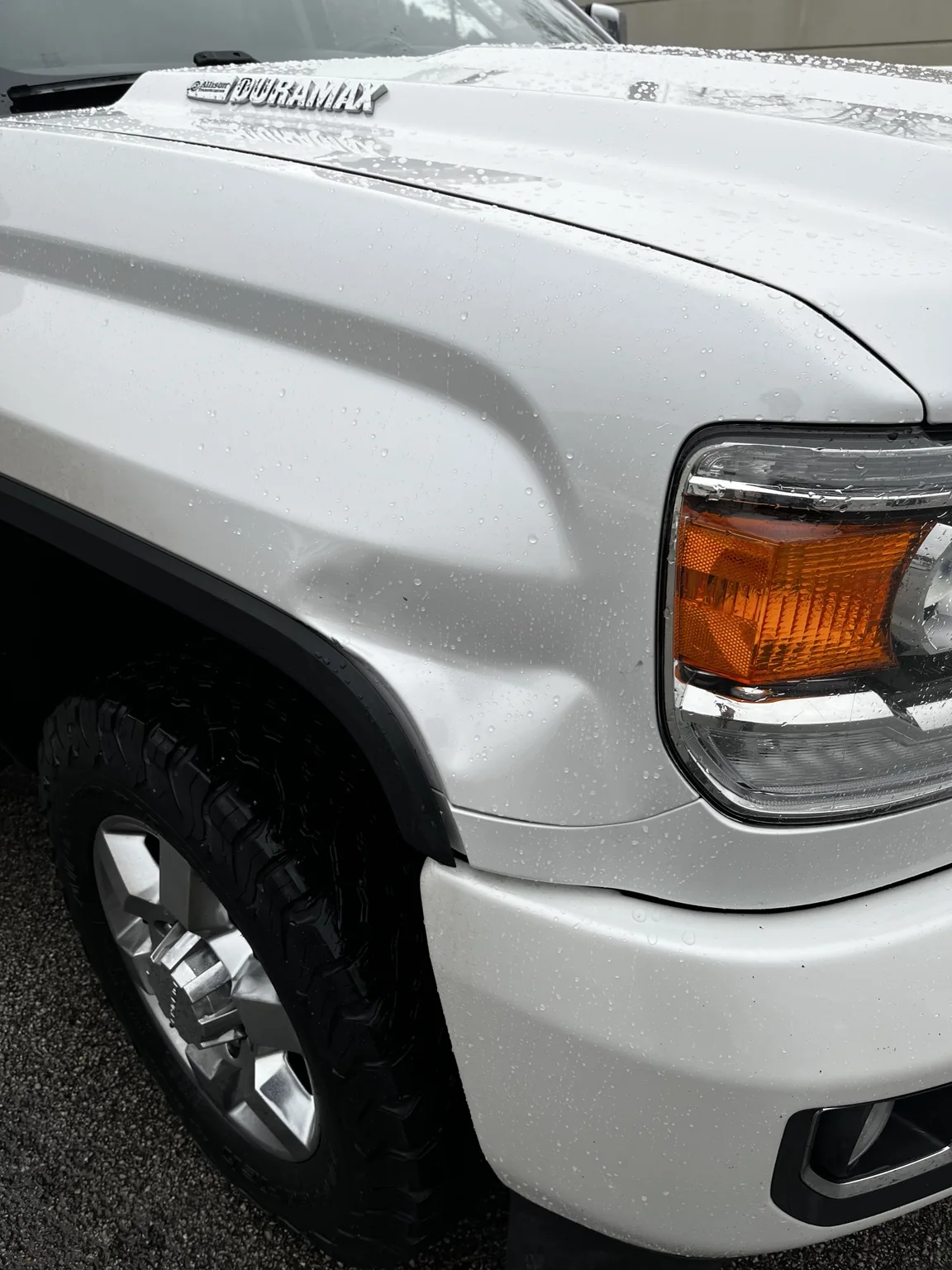 Duramax fender dent before paintless dent repair